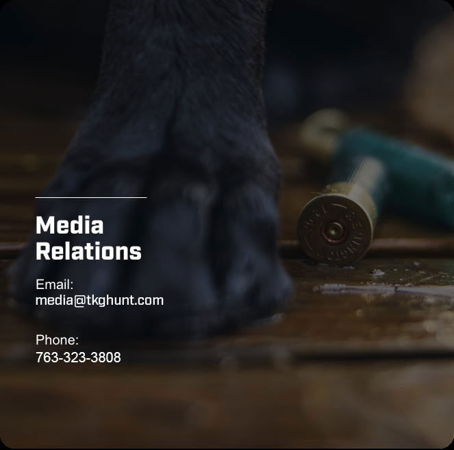 shotshells on the floor with dog paw; Media Relations; Email: media@TKGHunt.com; Phone: 763-323-3808