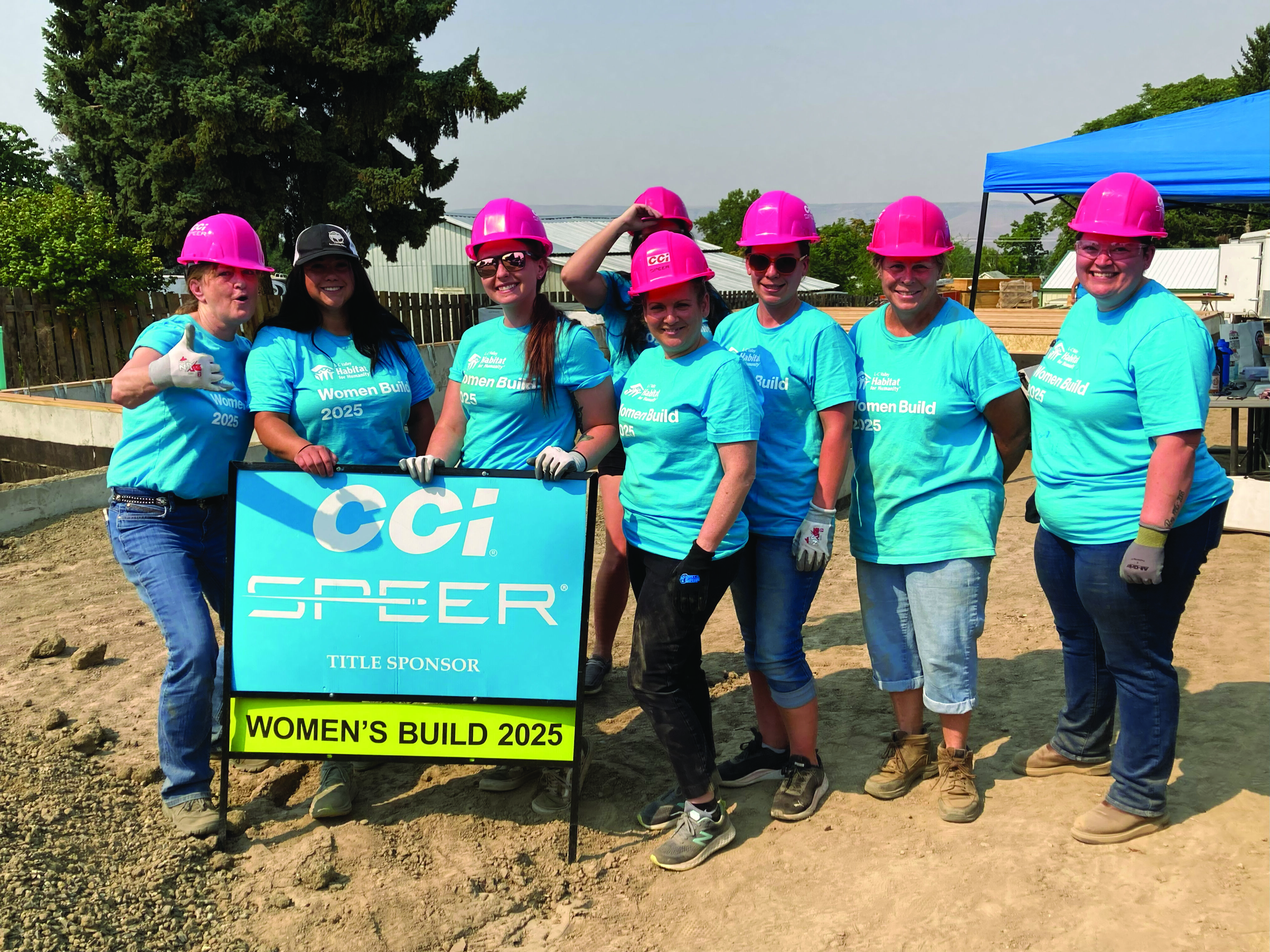 Kris standing with her grandchildre