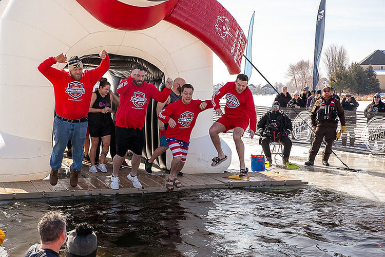 Team Shockwave jumping into frozen water