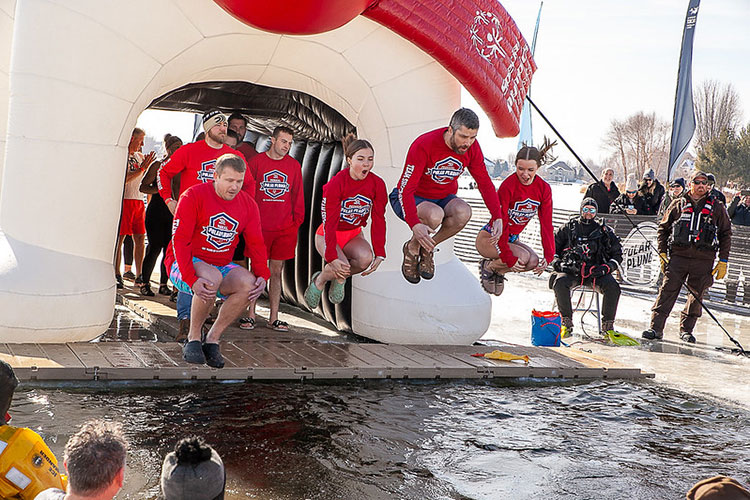 Team Shockwave jumping into frozen water
