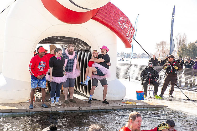 Team Shockwave jumping into frozen water