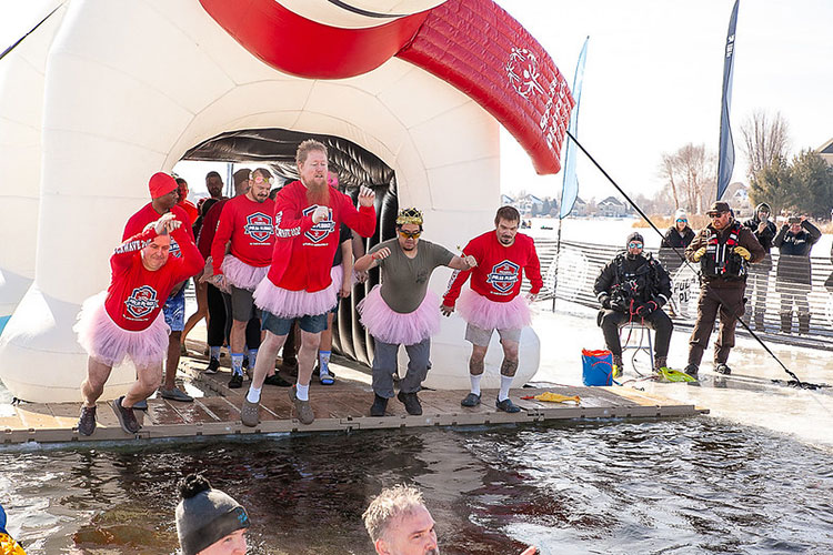 Team Shockwave jumping into frozen water