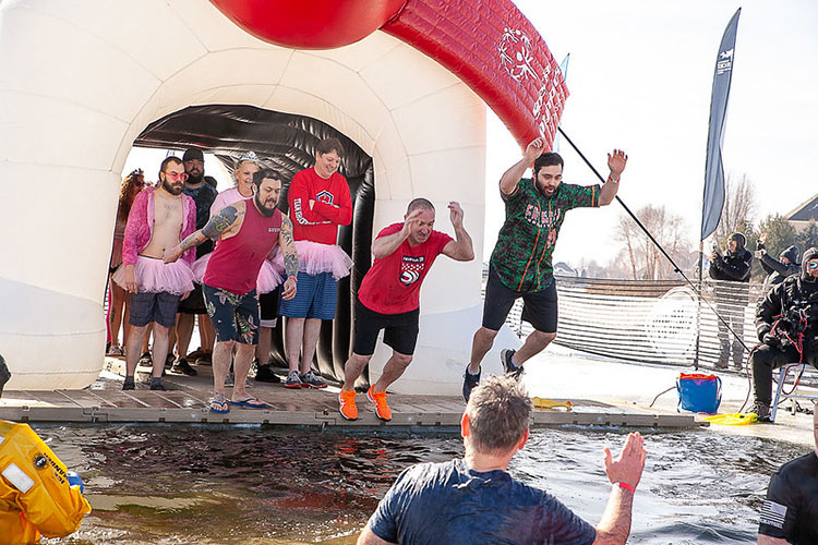 Team Shockwave jumping into frozen water