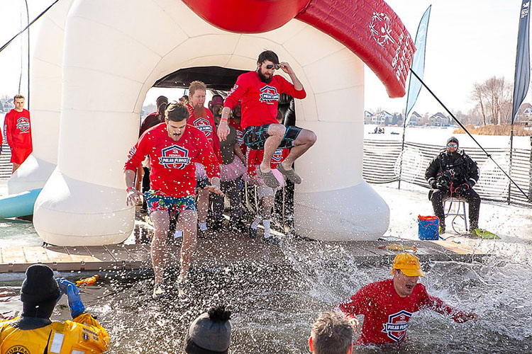 Team Shockwave jumping into frozen water