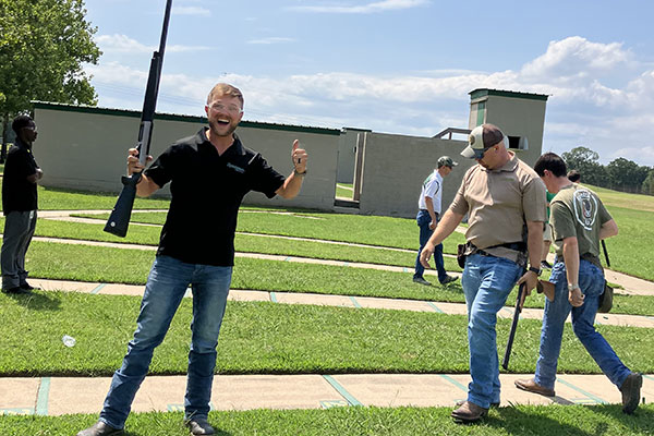 excited person with a thumbs up while at the Remington gun club