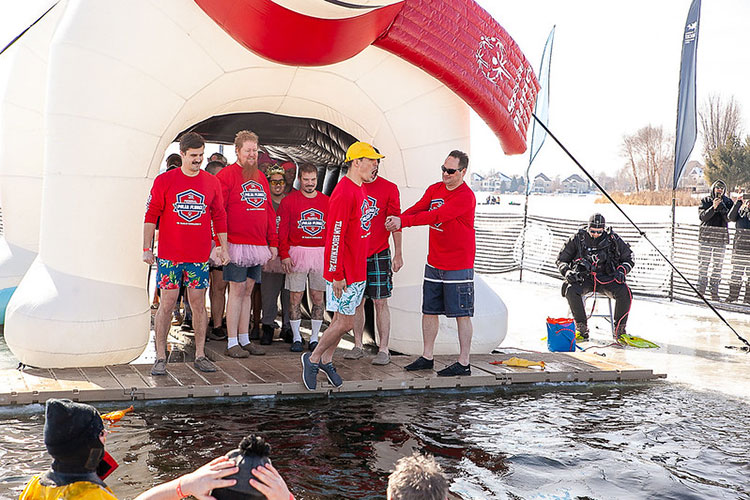Team Shockwave jumping into frozen water