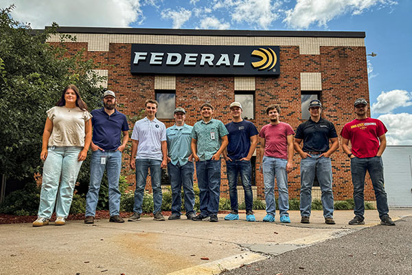 2024 interns standing outside the Federal factory