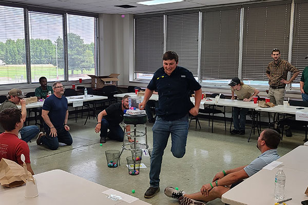 a person running from the center of a group of tables